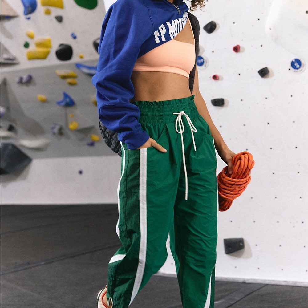 FP MOVEMENT THE CHAMP IS HERE TRACK PANTS NWT